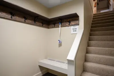 a staircase in a house with a stair case at 3BR in Foxglove, Wood Burning Fireplace, Mudroom, Near Gondola, Parking in Whistler