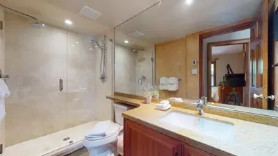 a bathroom with a sink and a shower and a toilet at 3BR in Blackcomb Greens, Wood Burning Fireplace, Complex Hot Tub, Parking, Mountain Views in Whistler