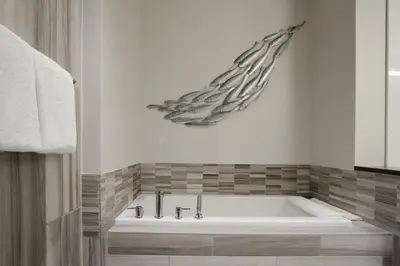 a bath tub in a bathroom with aificantificantificantificantificantificantificant at Luxury Mountain Retreat with PRIVATE Hot Tub by Harmony Whistler in Whistler