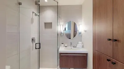 a bathroom with a sink and a shower at 1BR plus Loft in Glacier Lodge, King Bed, Near Gondola, Private Balcony, Free Ski Valet in Whistler