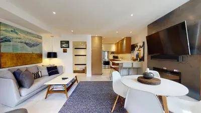 a living room with a couch and a table at 2BR in The Gables, Steps to Gondolas, Heated Floors, Private Balcony, Fireplace in Whistler