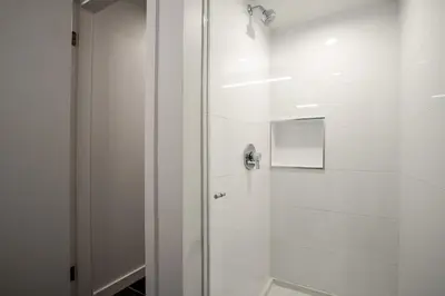 a shower with a glass door in a bathroom at 2BR plus Den in The Gables, Dog Friendly, Near Both Mountains, Wood Burning Fireplace, Free Parking in Whistler