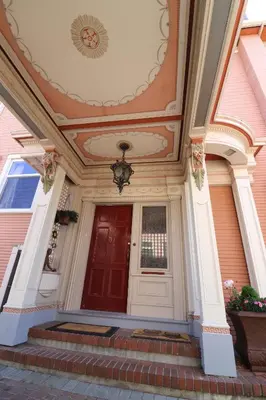 a front door of a house with a red door at Lipton Place by Elegant Waterfront in Victoria