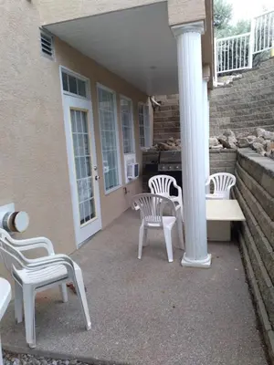 a group of chairs sitting on a porch at Fairmont Mountain View Villas in Fairmont Hot Springs