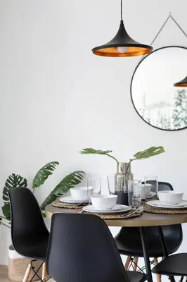 a dining room with a table and chairs at Contemporary & Spacious Slopeside 1BR Getaway in Whistler