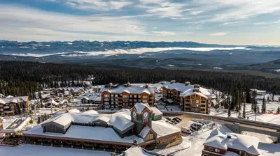 an aerial view of a resort in the snow at I Spy - Cozy Pet Friendly, Ski In Ski Out Condo with Private Hot Tub in Big White