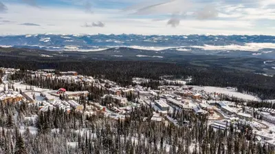 an aerial view of a ski resort in the snow at I Spy - Cozy Pet Friendly, Ski In Ski Out Condo with Private Hot Tub in Big White