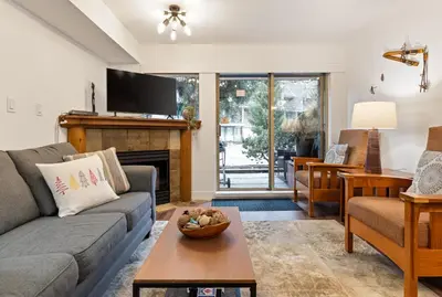 a living room with a couch and a fireplace at 3BR in Valhalla, Village Location, Communal Hot Tub, Gas Fireplace, Parking in Whistler