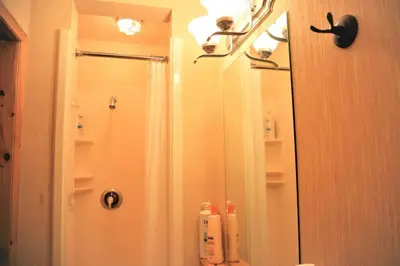 a bathroom with a shower and a mirror at MountainView -PrivateChalet Sleep7- 5min to DT Vacation Home in Canmore