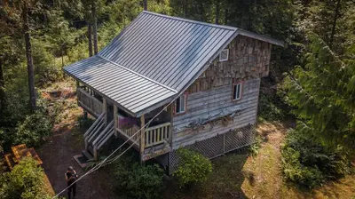 an overhead view of a house in the woods at Woods End Landing in Bamfield