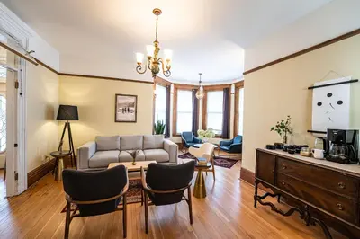a living room with a couch and a table and chairs at The Copeland in Revelstoke