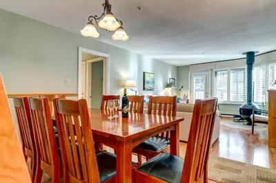 a dining room with a wooden table and chairs at Wintergreen 27 - Townhome in Whistler