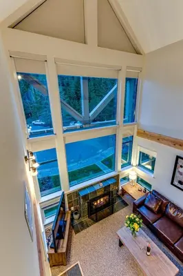 an overhead view of a living room with large windows at Greystone Lodge 413 - Largest in Whistler