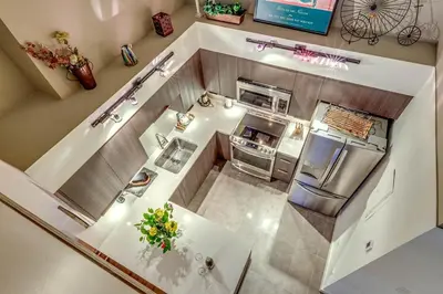 an overhead view of a small kitchen with a refrigerator at Greystone Lodge 310 Ski-in Out in Whistler
