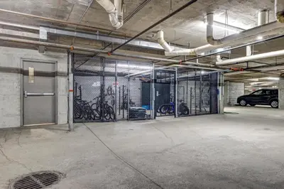 a garage with a bunch of bikes on the wall at Greystone Lodge 207 Ski-in Out in Whistler