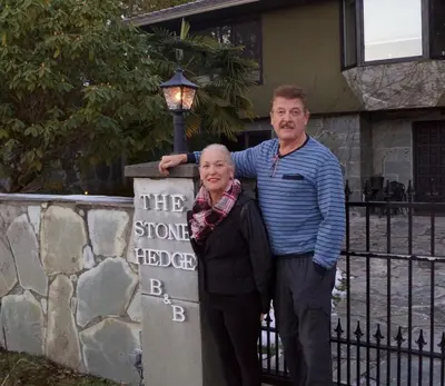 a man and a woman standing next to a street light at The Stone Hedge Bed and Breakfast in Richmond