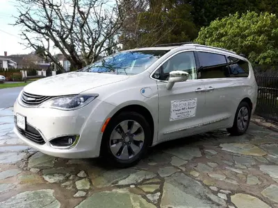 a white car is parked on a stone road at The Stone Hedge Bed and Breakfast in Richmond