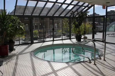 a hot tub in the middle of a patio at Your Vacation Home Downtown Vancouver in Vancouver
