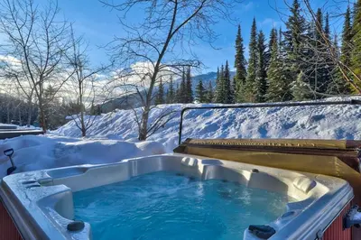 a jacuzzi tub in the snow at Crystal Forest #29 by Bear Country in Sun Peaks