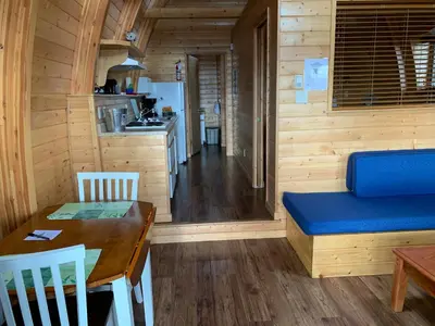 a kitchen and dining room with a table and a dining room at Oyster Bay Resort in Oyster Bay