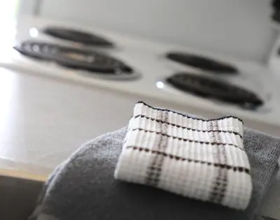 a close up of a towel on the arm of a stove at Duncan Motel in Duncan