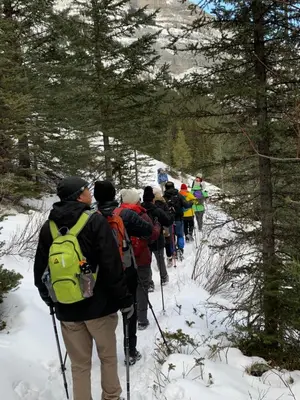 a group of people cross country skiing in the snow at 2-in-1 Skyline MTN Retreat - Hot Tub - Pool - AC in Canmore