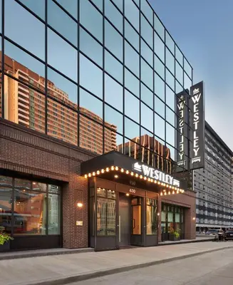 a building with a sign on the front of it at The Westley Calgary Downtown, Tapestry Collection By Hilton in Calgary