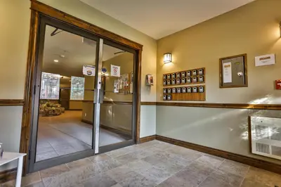 a tasting room with a glass door to a tasting room at Sable Ridge Condos by StayIn in Radium Hot Springs