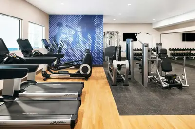 a gym with treadmills and cardio equipment in a room at Delta Hotels by Marriott Grande Prairie Airport in Grande Prairie