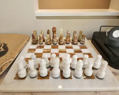 a chess set on a chessboard on a table at 3BR in Gleneagle, Ski Storage, Wood Burning Fireplace, Free Shuttle in Whistler