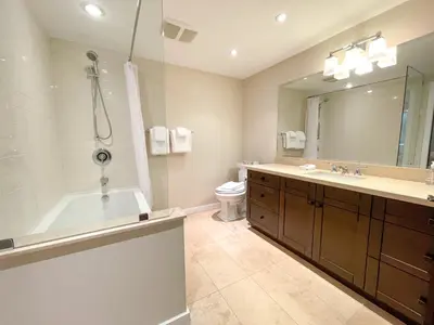 a bathroom with a tub and a toilet and a sink at 3BR in Gleneagle, Ski Storage, Wood Burning Fireplace, Free Shuttle in Whistler
