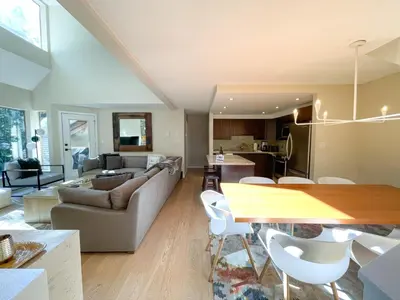a living room with a couch and a table at 3BR in Gleneagle, Ski Storage, Wood Burning Fireplace, Free Shuttle in Whistler