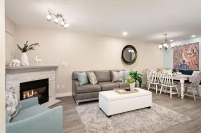 a living room with a couch and a fireplace at Renovated & Spacious 1bed/2bath Whistler Village in Whistler