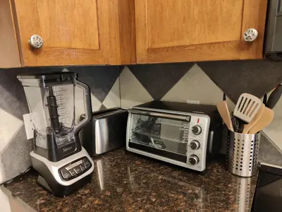 a kitchen counter with a blender and a toaster oven at The Lambeth by Samsara Resort Private Entry Panorama Top View 2BR and 2BTH in Canmore
