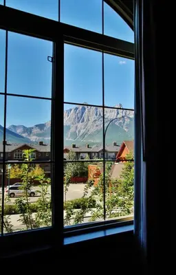 a view of a mountain from a window at The Lambeth by Samsara Resort Private Entry Panorama Top View 2BR and 2BTH in Canmore