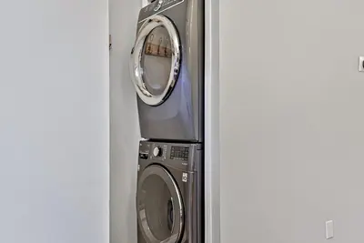 a washing machine and a dryer in a room at The Lambeth by Samsara Resort Private Entry Panorama Top View 2BR and 2BTH in Canmore