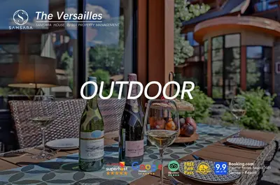 two bottles of wine sitting on a table with glasses at The Versailles by Samsara Resort Top Luxury Top View 1300SQF 2BEDROOM 2BATHROM in Canmore
