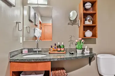 a bathroom with a sink and a toilet at The Versailles by Samsara Resort Top Luxury Top View 1300SQF 2BEDROOM 2BATHROM in Canmore