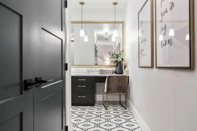 a bathroom with a sink and a mirror at The Inn on Officers' Garden in Calgary