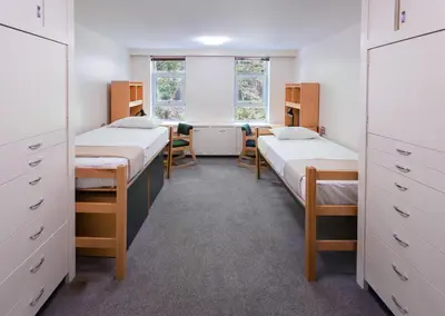 a dorm room with two beds and a window at Pacific Spirit Hostel in Vancouver