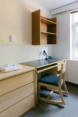 a kitchen with a desk with a chair in it at Pacific Spirit Hostel in Vancouver