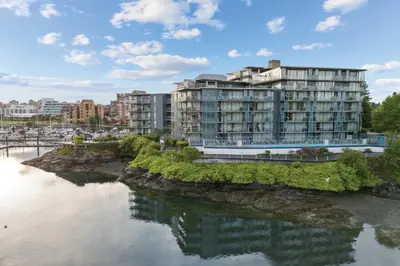 a large apartment building next to a river at WorldMark Victoria in Victoria