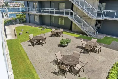an outdoor patio with tables and chairs on a building at WorldMark Victoria in Victoria