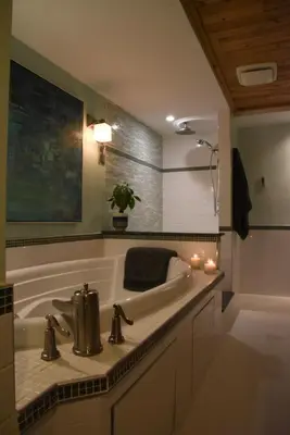 a bathroom with a sink and a tub with candles at Les Chambres Roses in West Kelowna