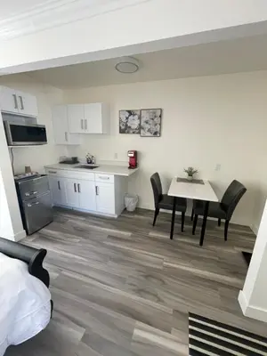a kitchen and dining room with a table and chairs at Destination INN in Radium Hot Springs