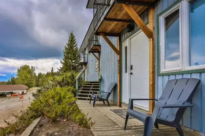 a pair of chairs sitting on the porch of a house at Silver Birch by StayIn in Kimberley