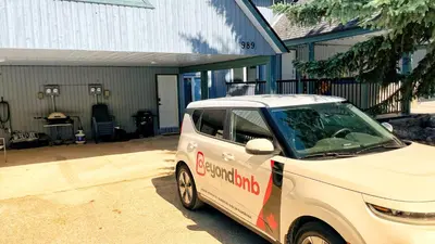 a small car parked in front of a garage at Silver Birch by StayIn in Kimberley
