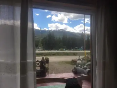 a window with a view of a mountain view at Jade Fever Cabina in Jade City