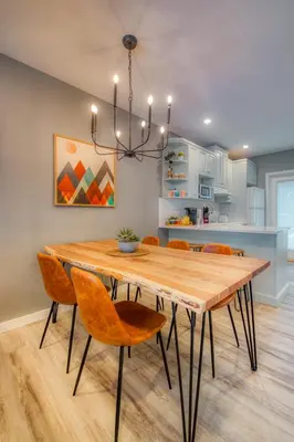 a dining room with a wooden table and chairs at Beautiful Newly Reno 2BDM 2 Bth Sleep up to 6 Adults & Kids Mountain View Townhouse Suite in Canmore