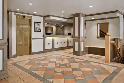 a large room with a lobby with a checkerboard floor at Days Inn by Wyndham Vancouver Downtown in Vancouver